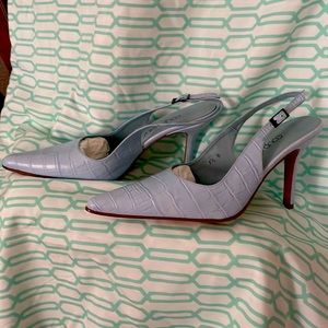 Pumps light blue in color, 3 1/2 inch heel